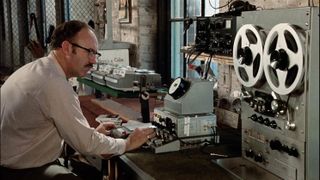 gene hackman sits in front of audio recording technology in a still from the conversation