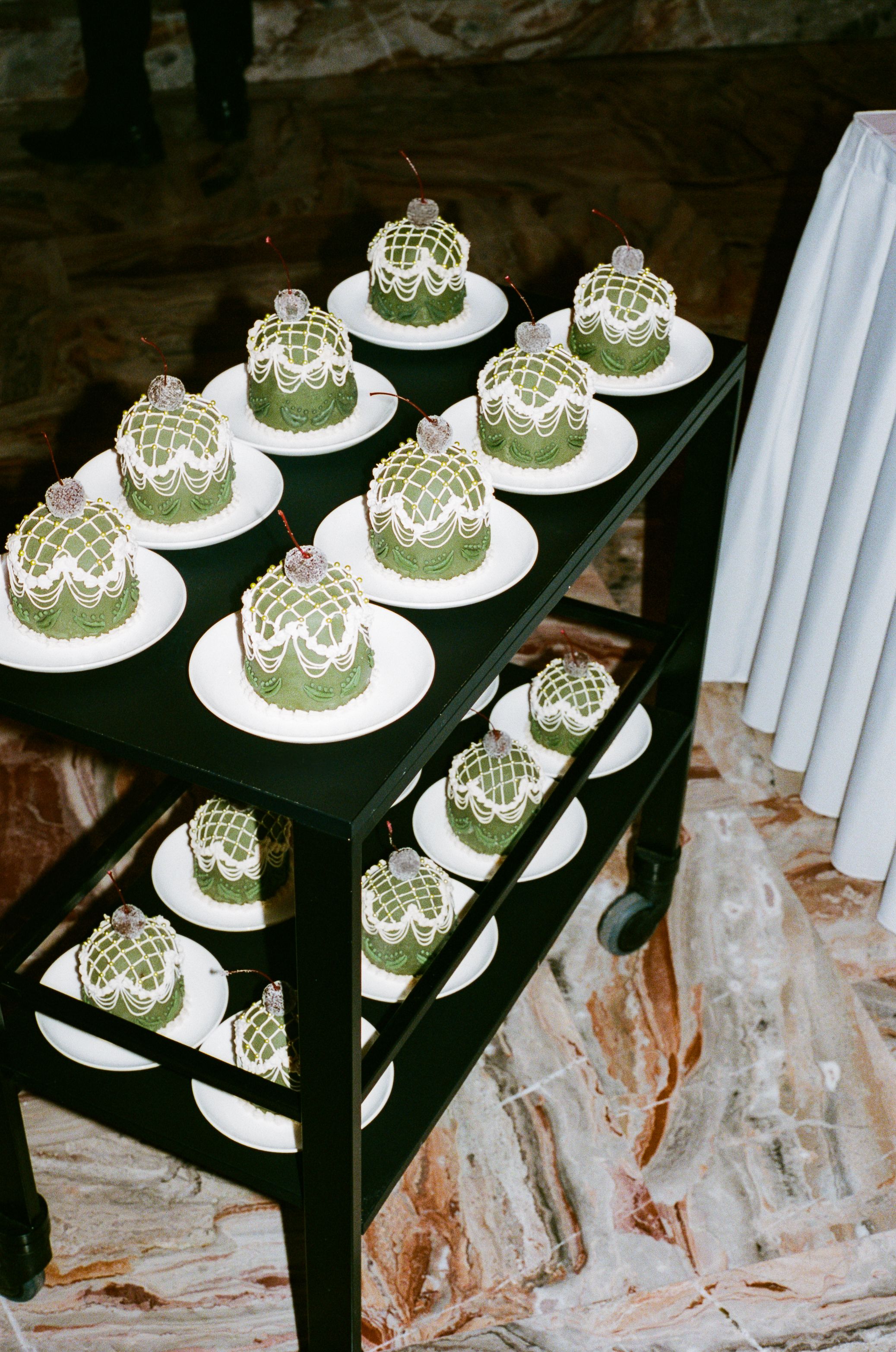 green panettone on a dessert trolley