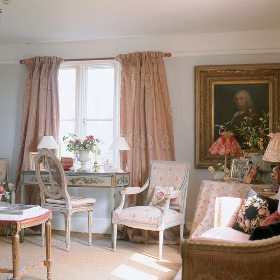 living room with white wall white window with curtain chairs and frame on wall