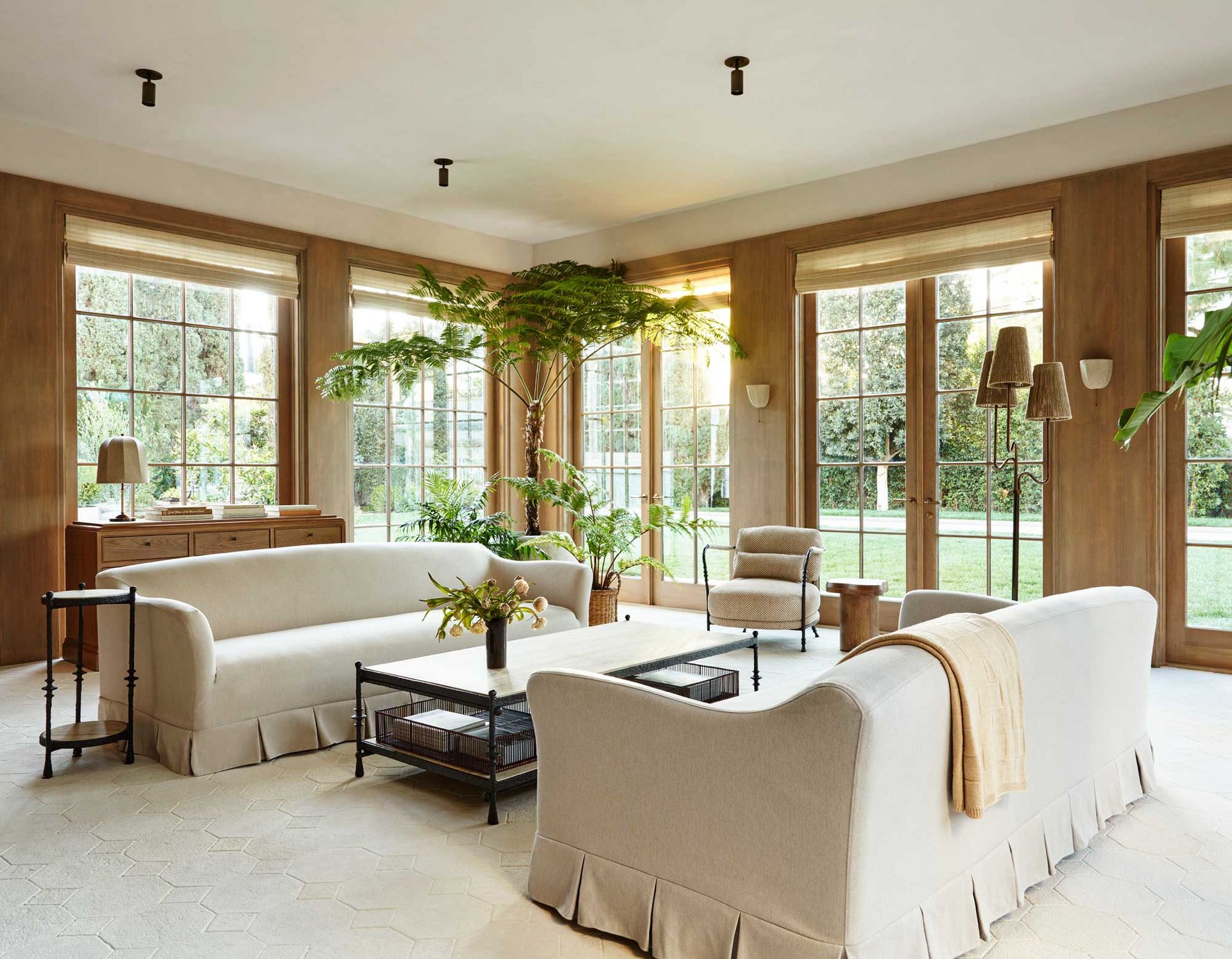 a modern living room with two white sofas