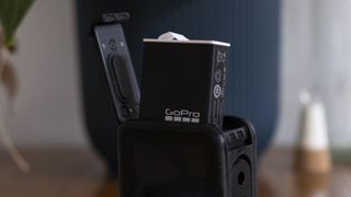 A GoPro Enduro battery poking out the top of a GoPro