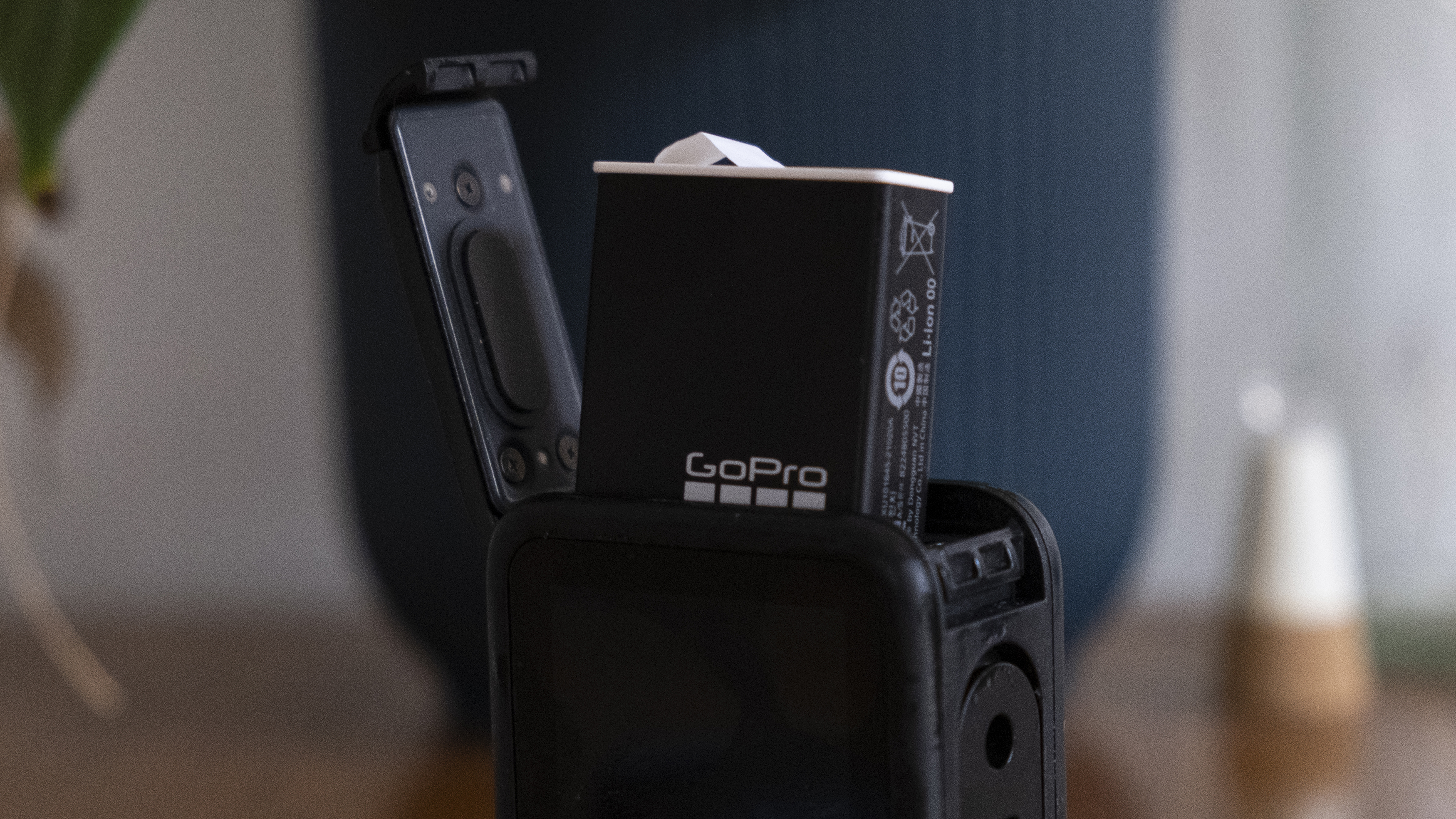 A GoPro Enduro battery poking out the top of a GoPro