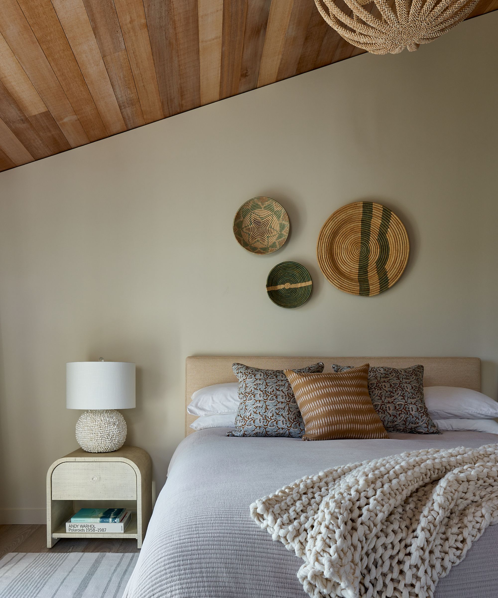 calming bedroom with beige walls and neutral decor with wood ceiling