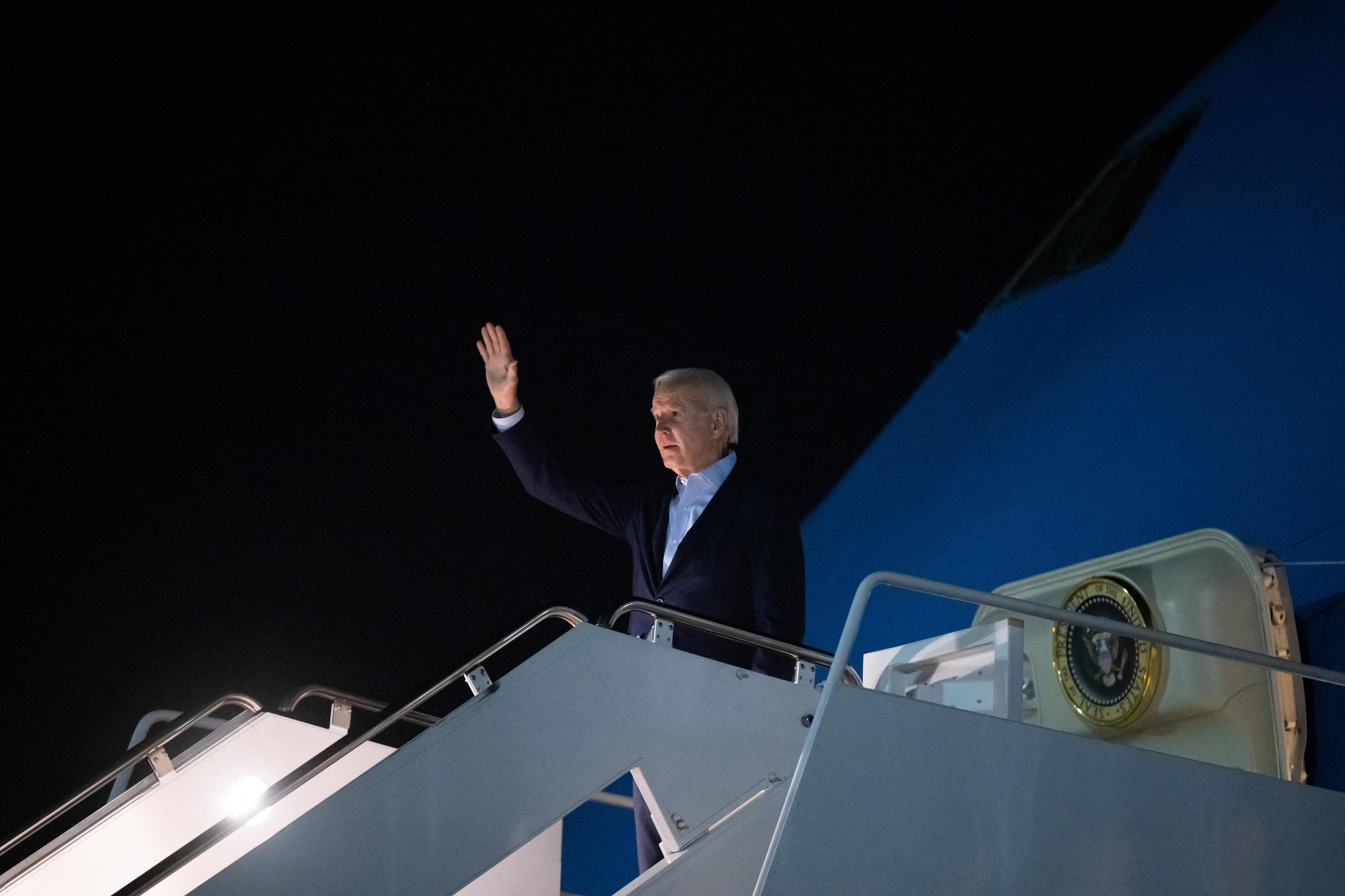 President Biden waves prior to boarding Air Force One.