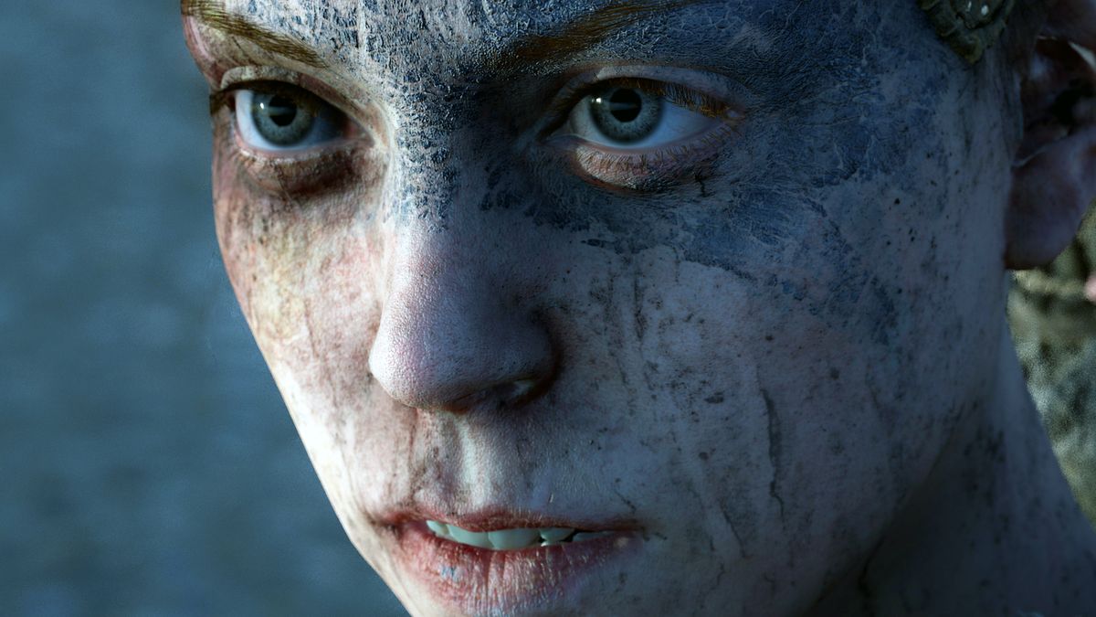 Hellblade: Sensua&#039;s Sacrifice hero character Senua staring at the viewer. Her face is covered in warpaint