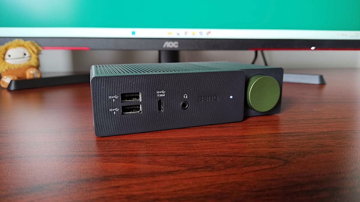BenQ BeCreatus docking station sitting on wood desk facing forward