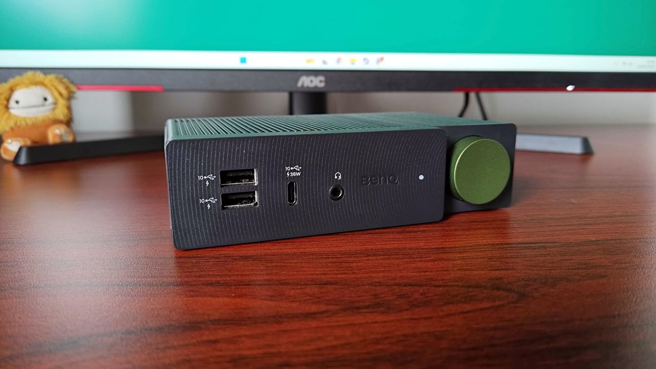 BenQ BeCreatus docking station sitting on wood desk facing forward