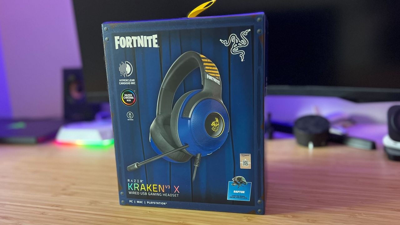 Razer Kraken V3 X Fortnite Edition gaming headset boxed on a wooden desk