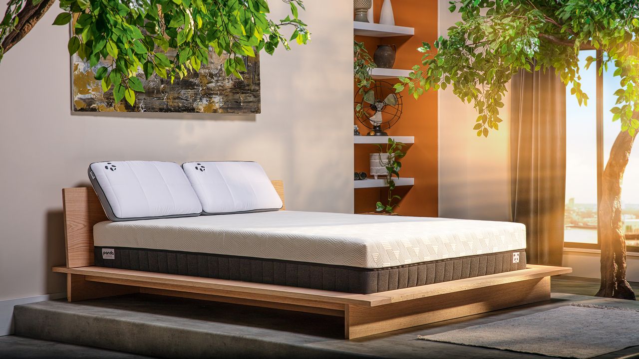 Floating bed in a modern bedroom with a Panda mattress and pillows