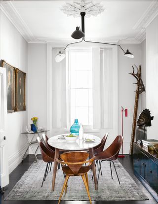 white dining room with white oval table