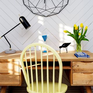 how to panel a wall, home office with chevron wall paneling, desk, large wire clock, yellow chair, desk lamp