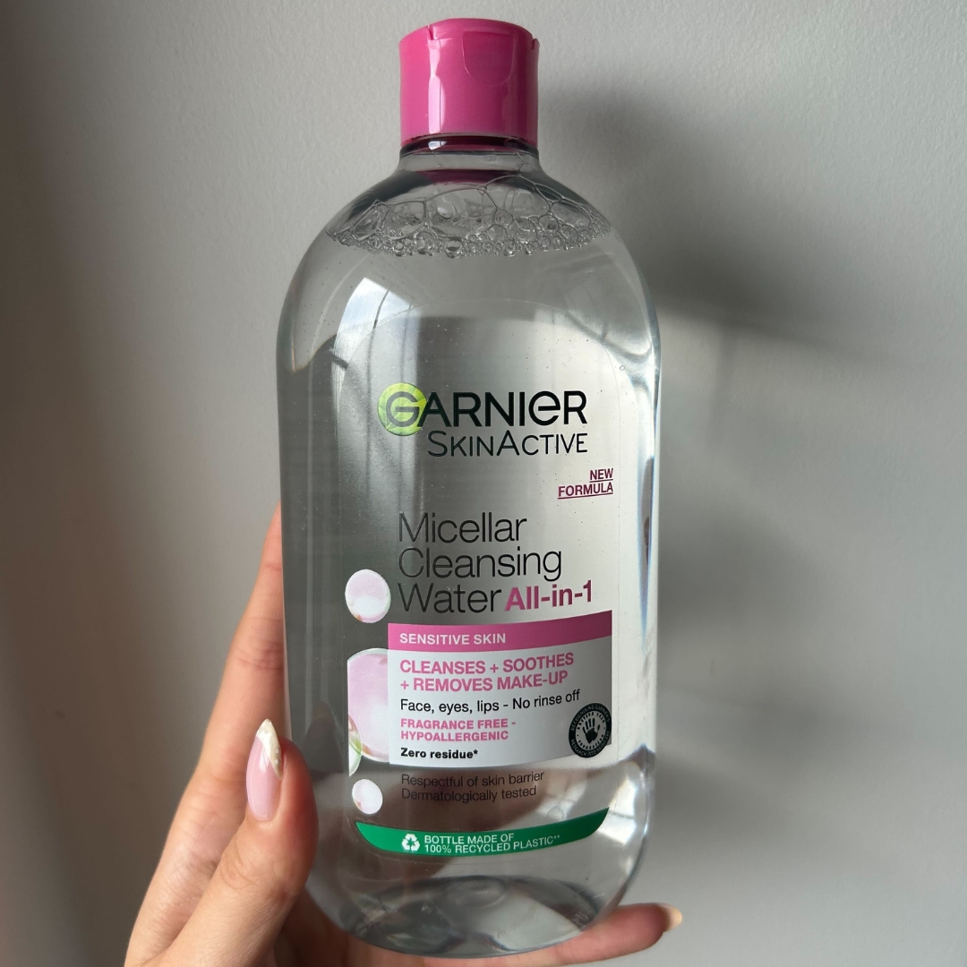 Hand holding a bottle of Garnier Micellar Water