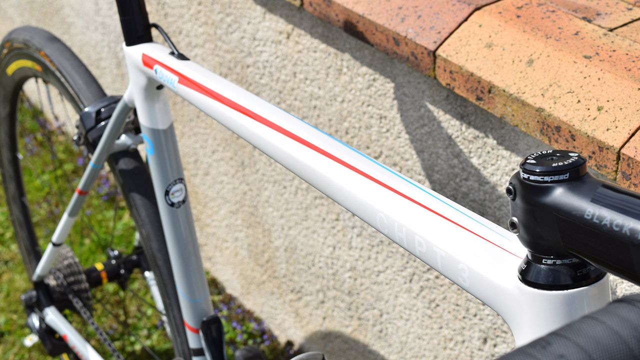 A geometric red, white and blue design adorns the top tube
