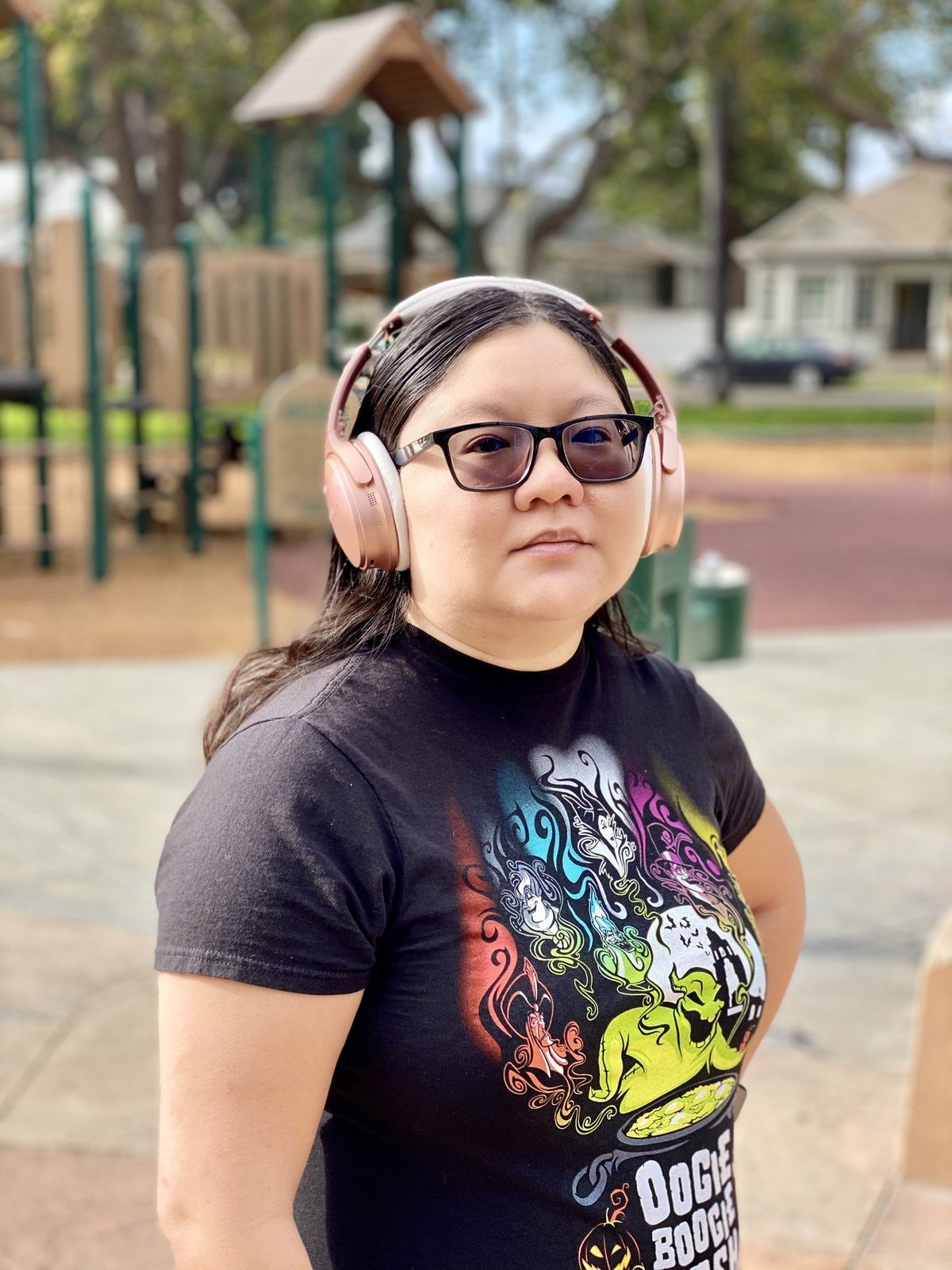 Christine wears her Rose Gold Bose QuietComfort 35 II headphones