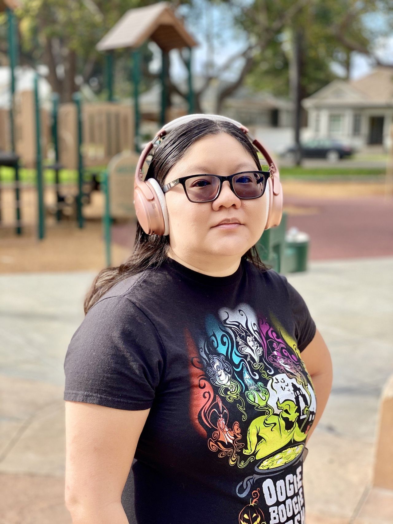 Christine wears her Rose Gold Bose QuietComfort 35 II headphones
