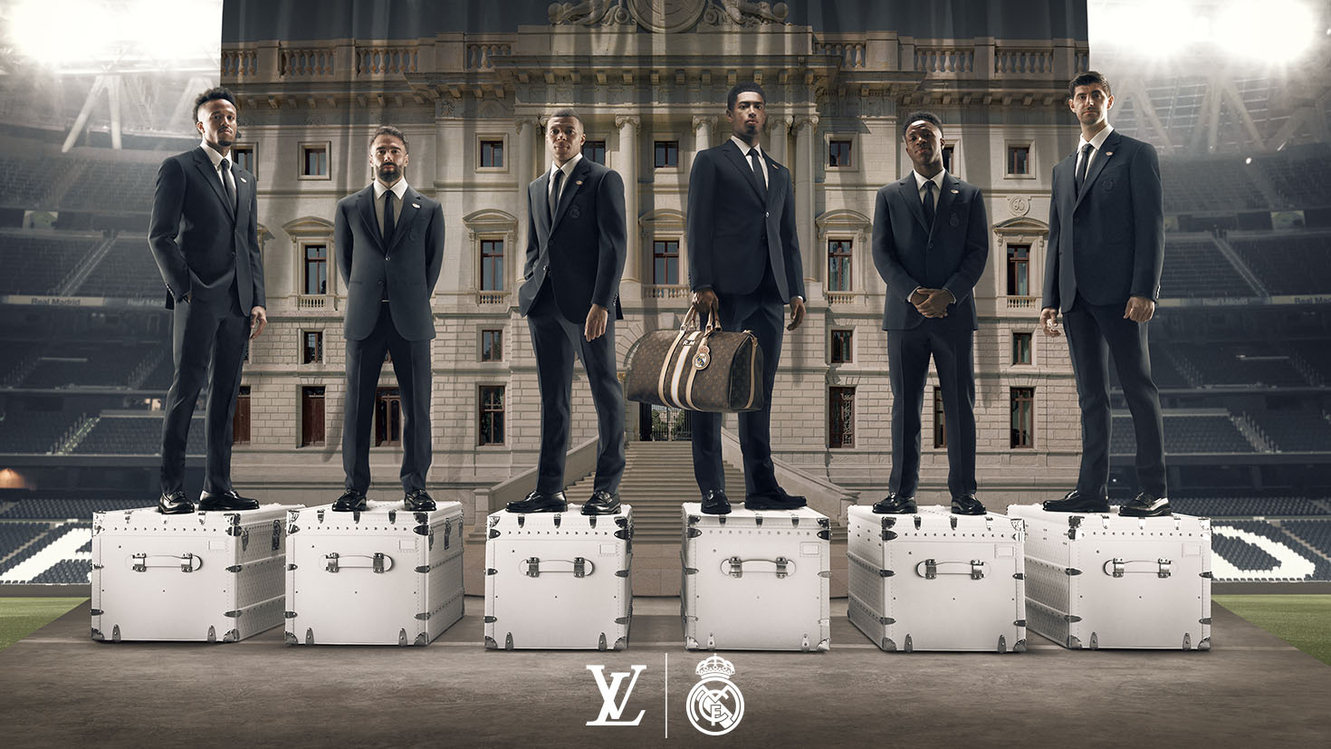 Members of the Real Madrid men's soccer team pose on Louis Vuitton trunks.