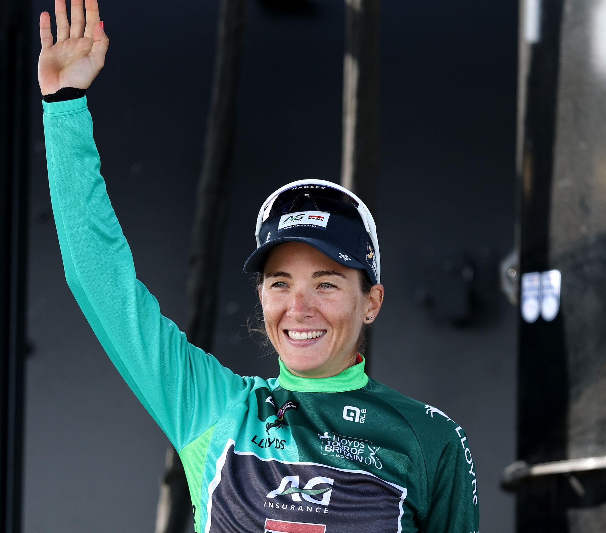 Kim Le Court-Pienaar of Team AG Insurance - Soudal Team celebrates at podium as Green Leader Jersey winner after stage 3