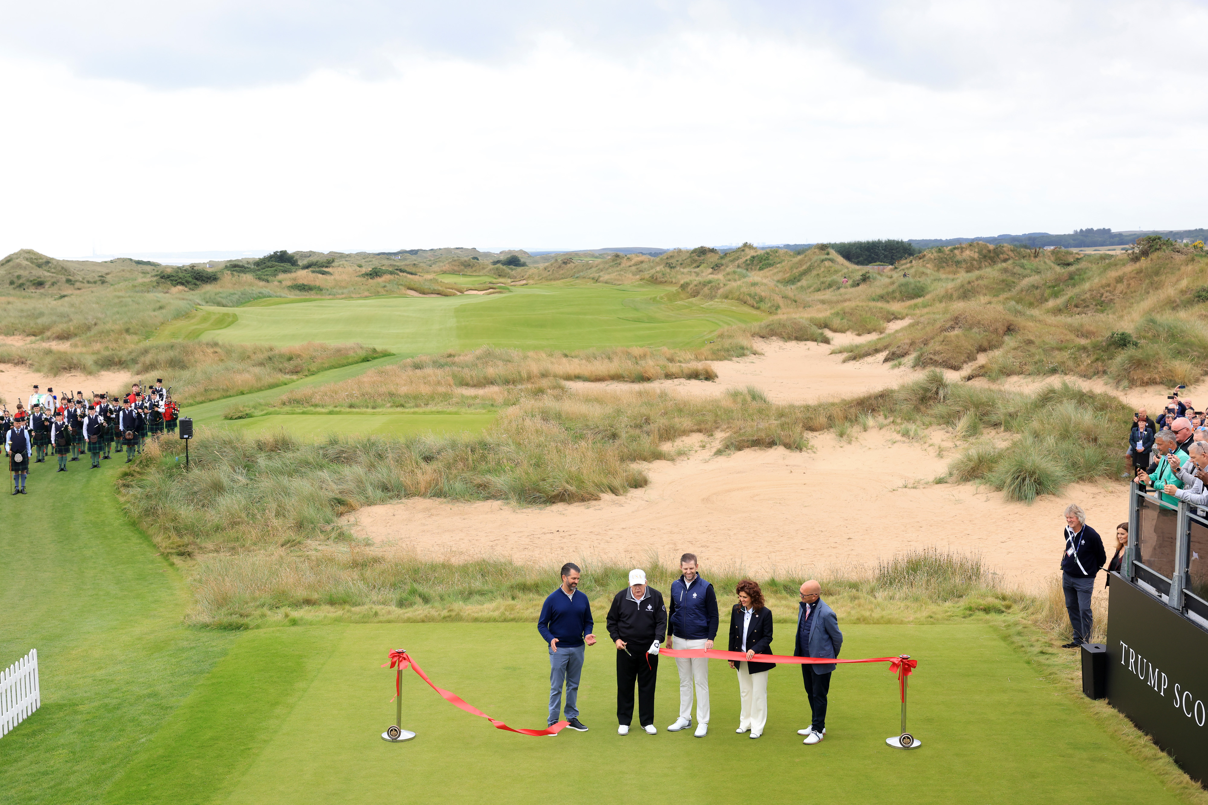 POTUS Donald Trump cuts the red ribbon on his new International Golf Links course in Scotland