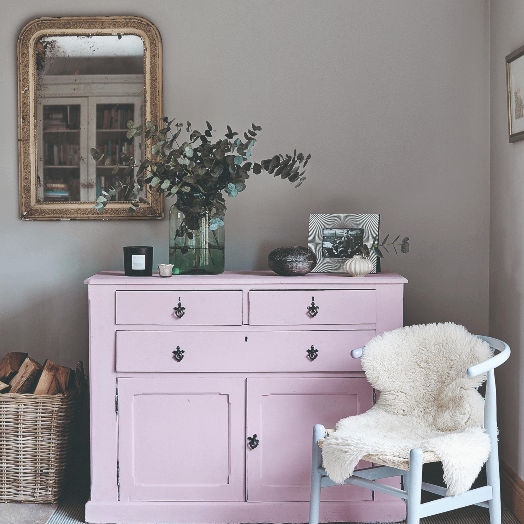 Pink dresser with grey bedroom