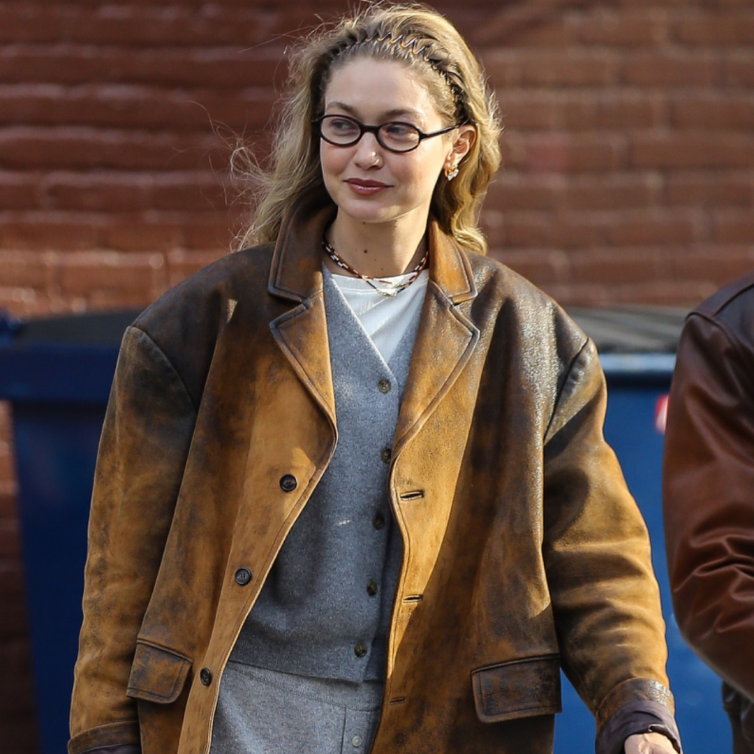 Gigi Hadid wore gray Guest In Residence sweatpants with a leather Miu Miu blazer and the soft loafers trend in suede