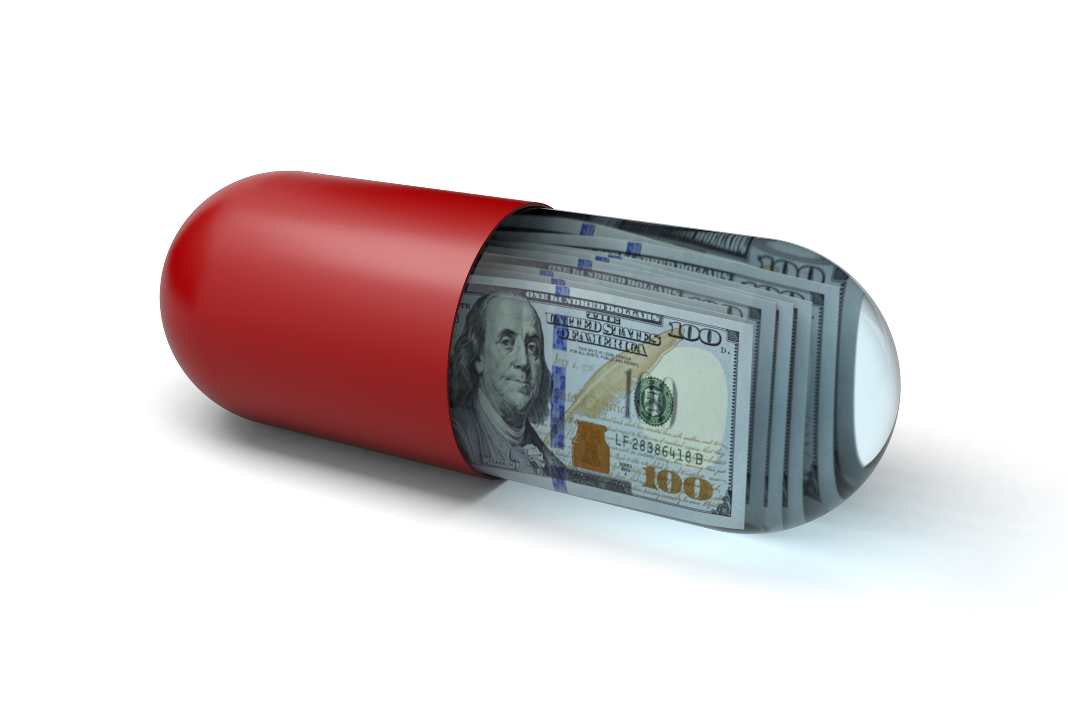 A prescription pill or capsule filled with one hundred dollar bills concept image on a white background with clipping path.