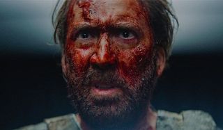 Mandy Nicolas Cage his confused face covered in blood