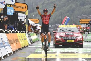 Team Bahrain's Dylan Teuns of Belgium celebrates as he crosses the finish line at the end 8th stage of the 108th edition of the Tour de France cycling race, 150 km between Oyonnax and Le Grand-Bornand, on July 03, 2021. (Photo by Philippe LOPEZ / AFP) (Photo by PHILIPPE LOPEZ/AFP via Getty Images)