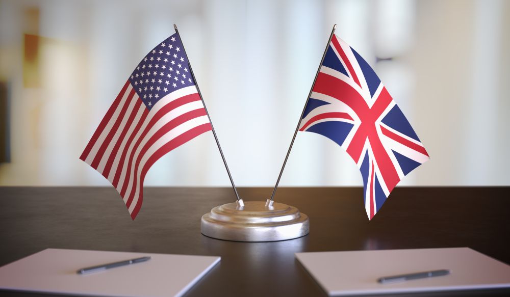 Mini US and UK flags on the desk of an ambassador 