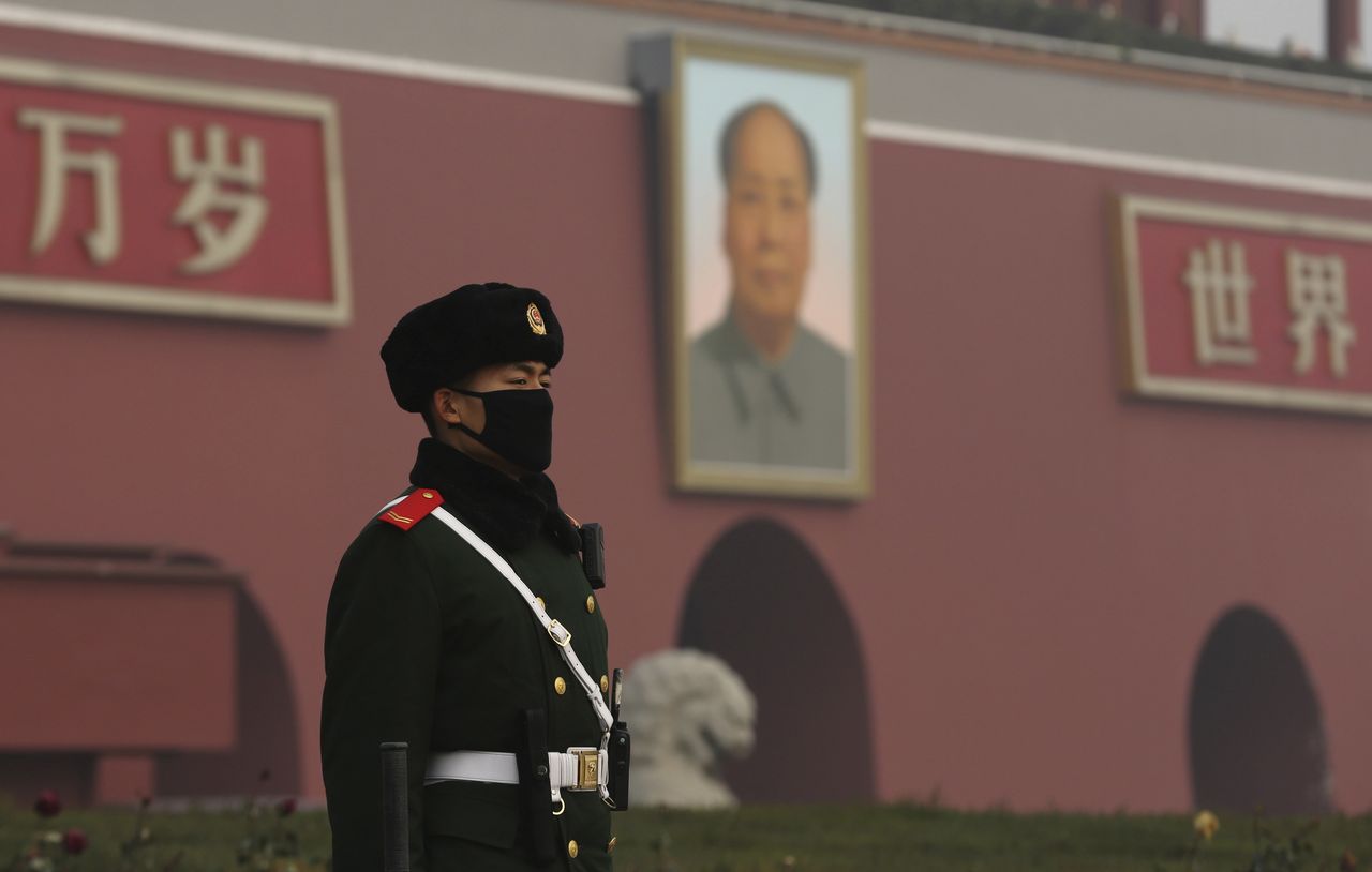 A parliamentary policeman stands guard.