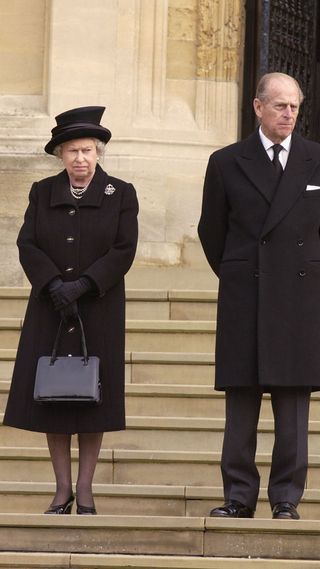Queen Elizabeth II and Prince Philip attending a funeral