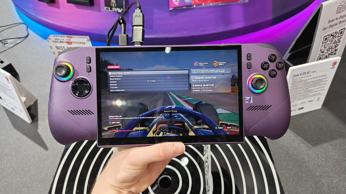 A reviewer holding The MSI Claw 8 EX AI+