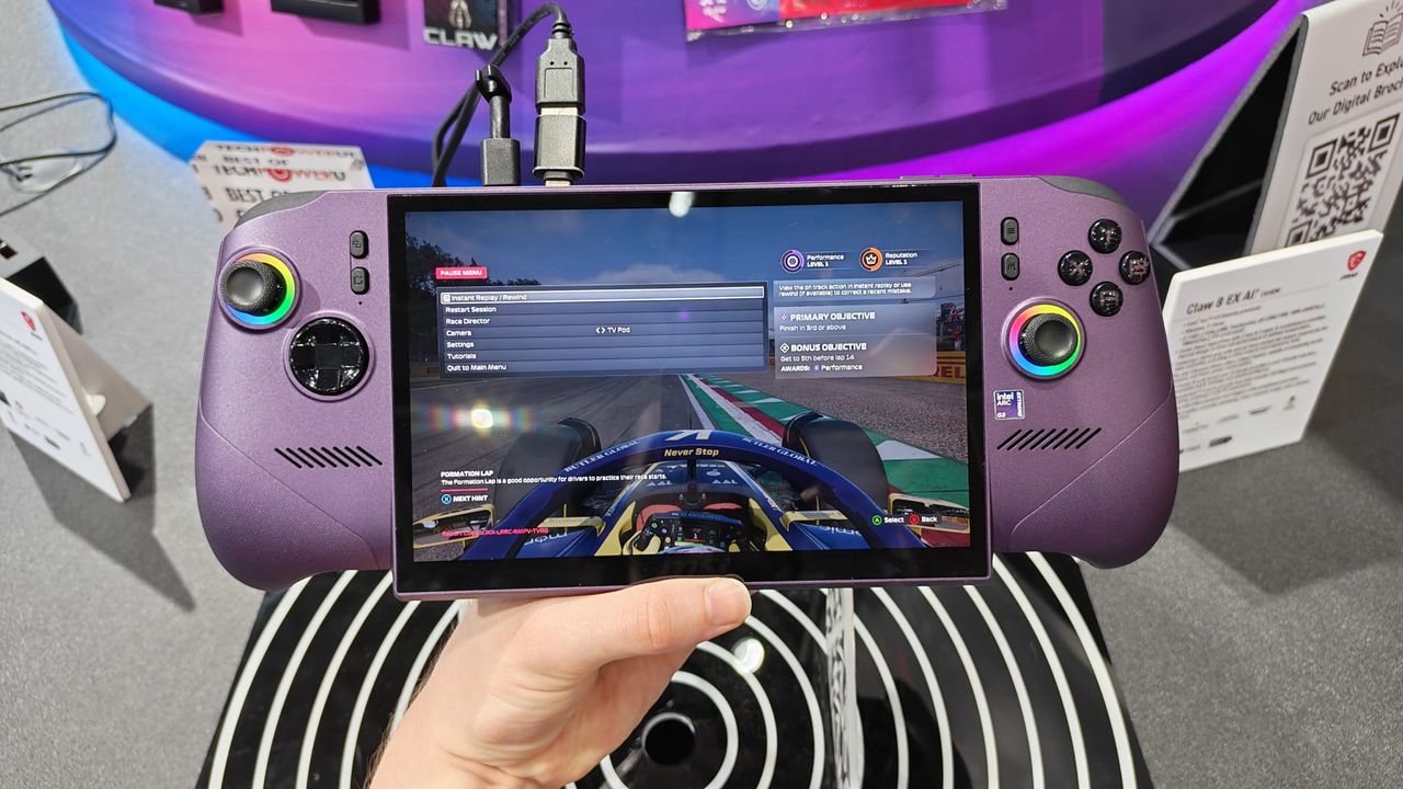 A reviewer holding The MSI Claw 8 EX AI+