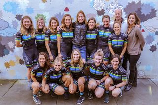 The riders unite with Tibco and Silicon Valley Bank executives for a team photo