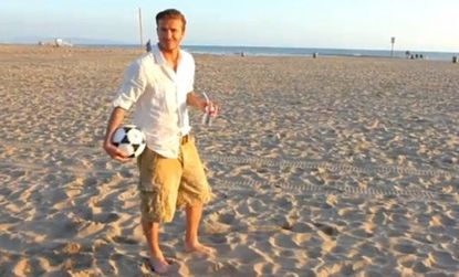 David Beckham says that kicking soccer balls into the three trash cans seen in the distance is easier than just getting one. And if you believe the video, he's right.