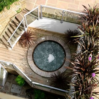 Aerial view of a hot tub surrounded by wooden decking