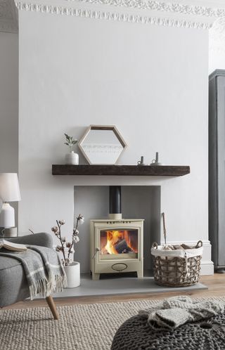 Cosy living room with stove by Arada Stoves