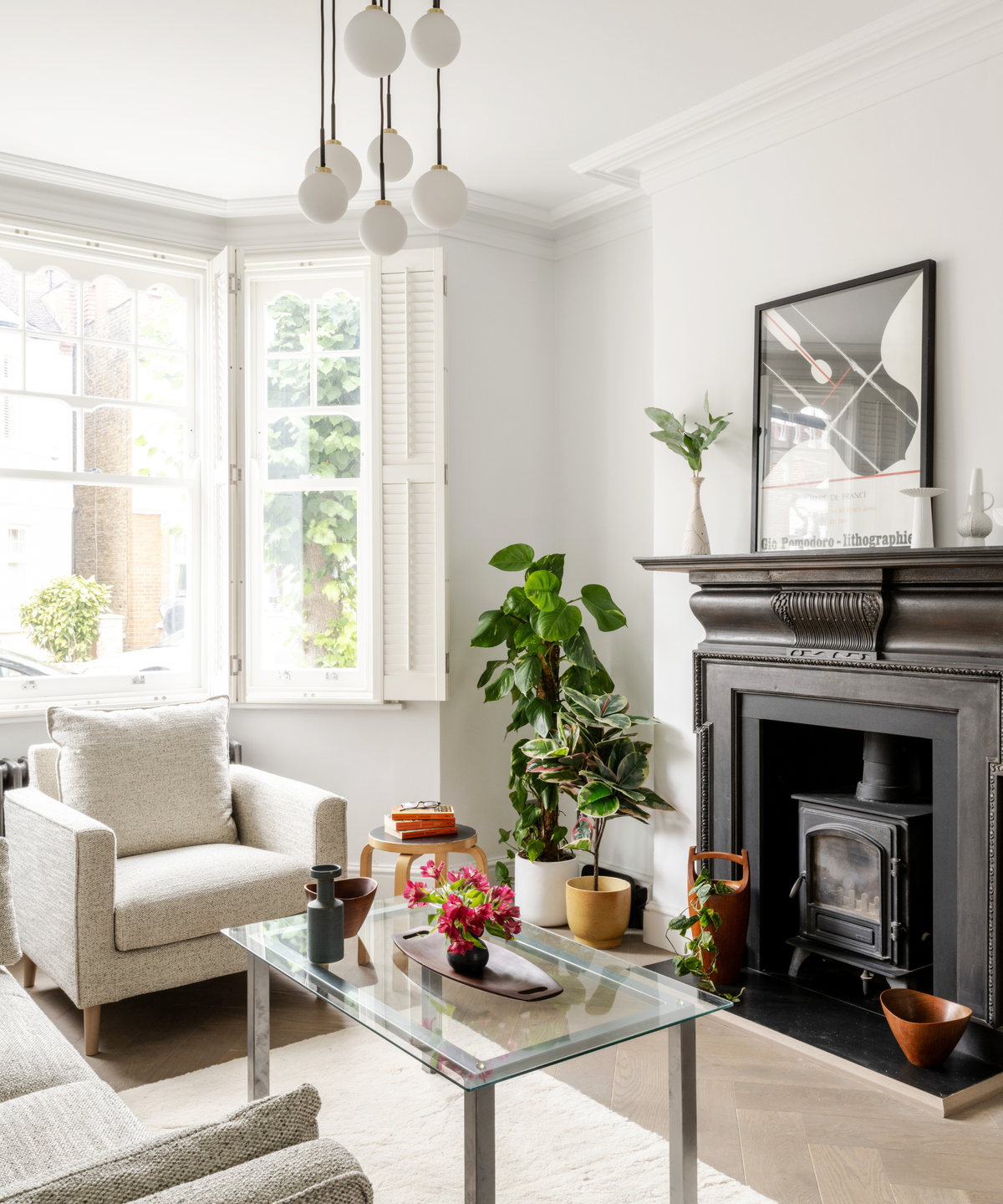 living room with white furniture and black fireplace