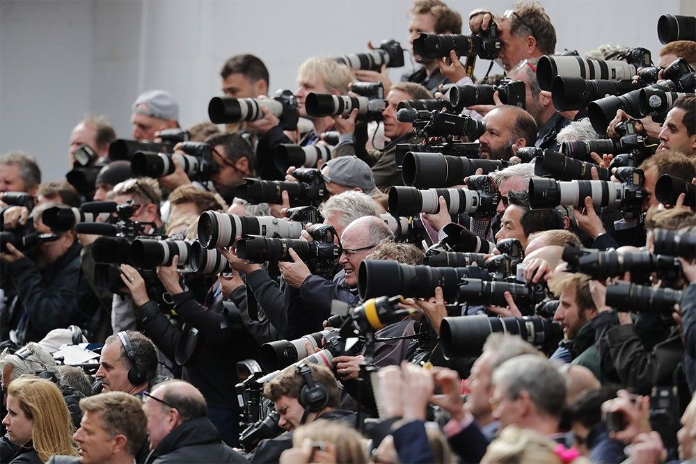 Photographers clamour to get a shot as Prince William and Catherine, Duchess of Cambridge, leave St Mary’s Hospital with their son Louis in 2018.