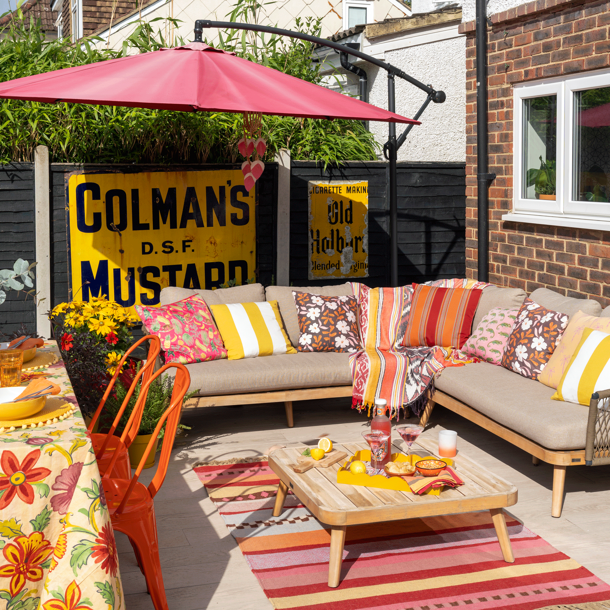 Bold colour and container planting have transformed this garden into an easy-to-maintain space that's a joy to entertain in