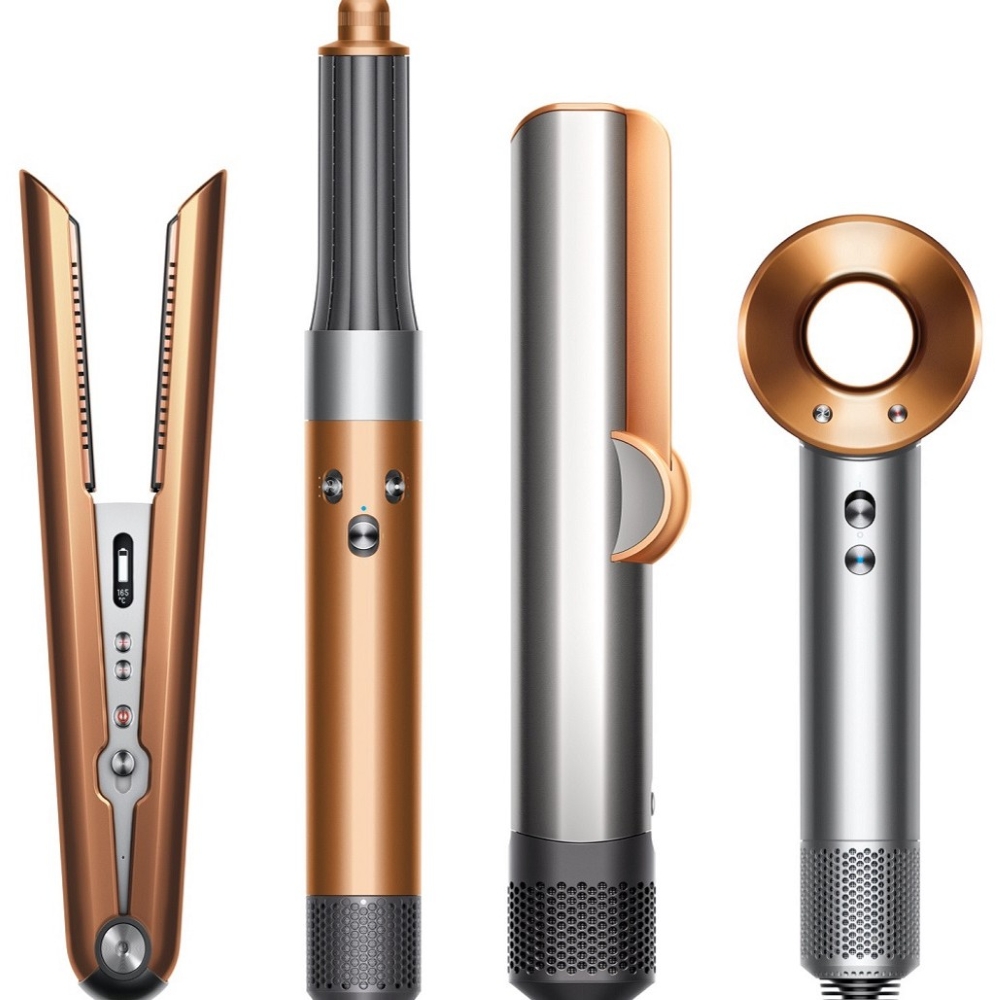 Four Dyson haircare tools in copper and platinum