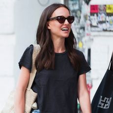 Natalie Portman wore black Hoka sneakers with jean shorts in NYC.