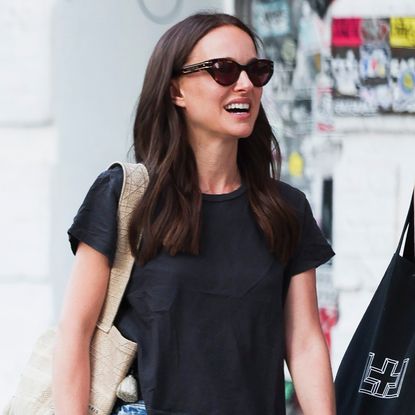 Natalie Portman wore black Hoka sneakers with jean shorts in NYC.