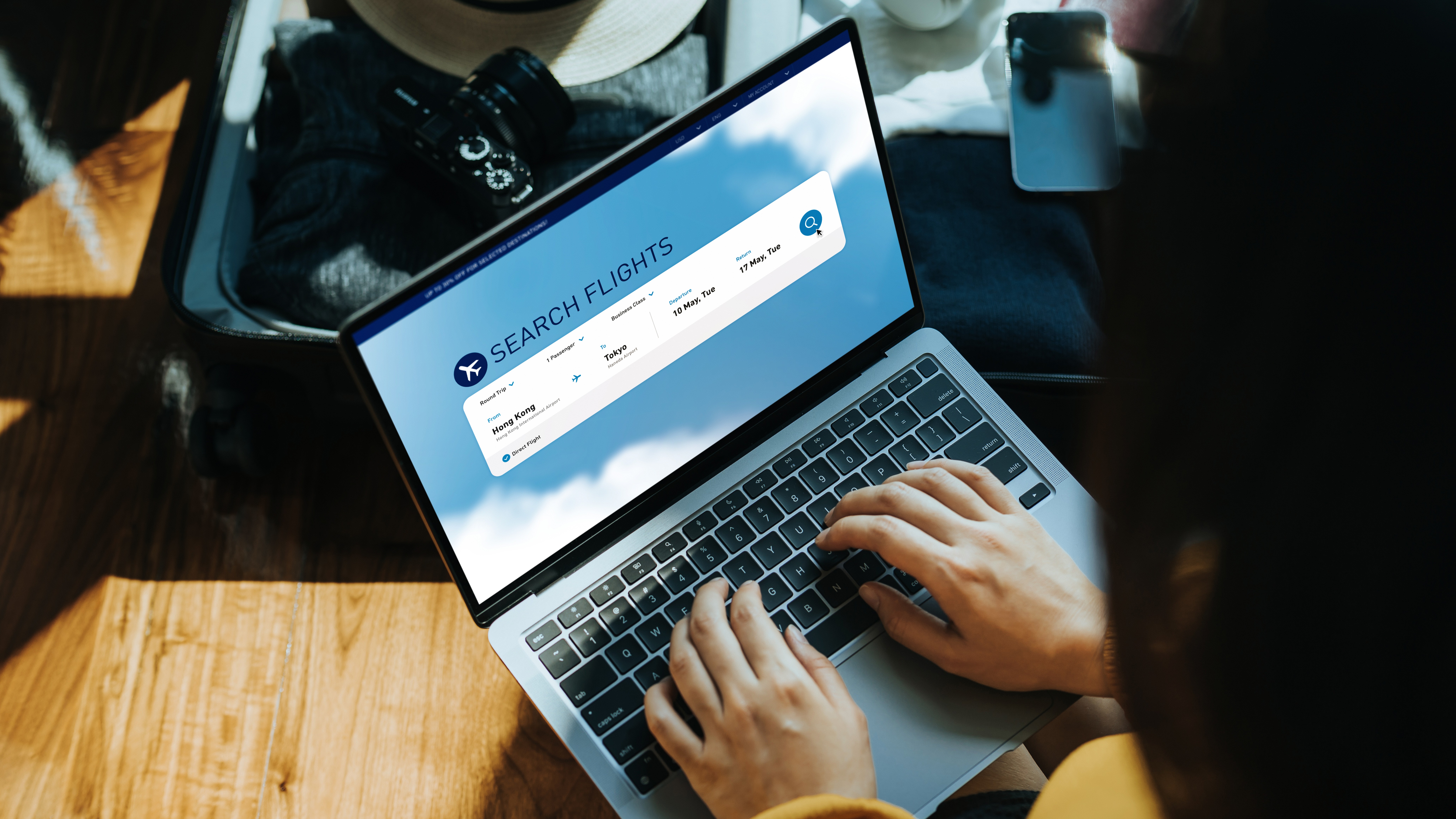 Person searching for flights on a laptop 
