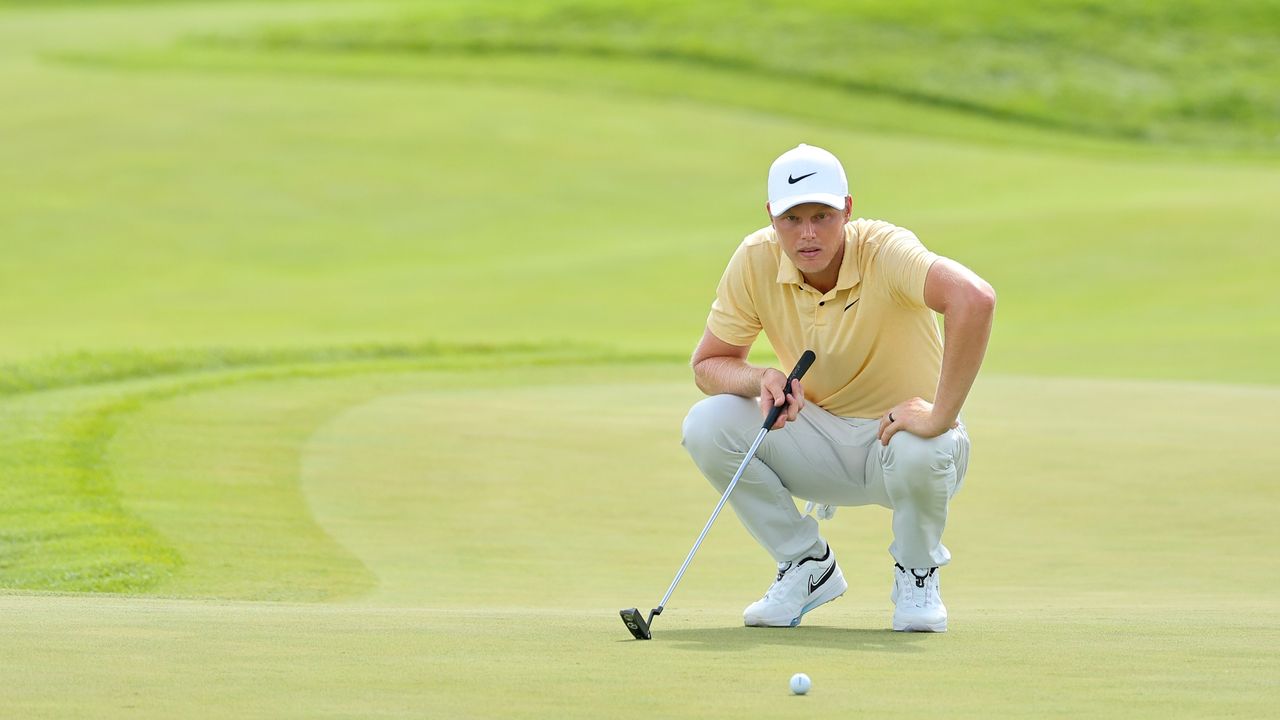 Cam Davis lines up his putt on the 18th green during the 3M Open.