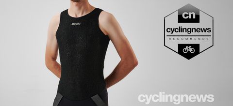 A front-on view of Josh wearing the Santini Alpha Base Layer, overlaid with a recommends badge