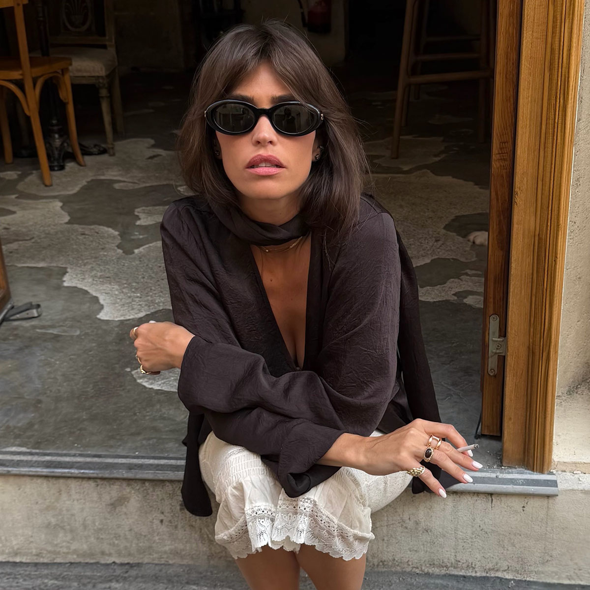 French woman in a brown top 