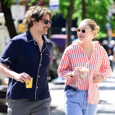 gigi hadid is seen on a coffee run with boyfriend bradley cooper wearing vintage jeans and a red striped button-down