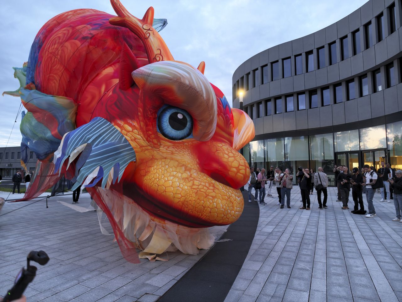 Insta360 Luna Ultra sample gallery: large inflated Chinese dragon in urban area at blue hour