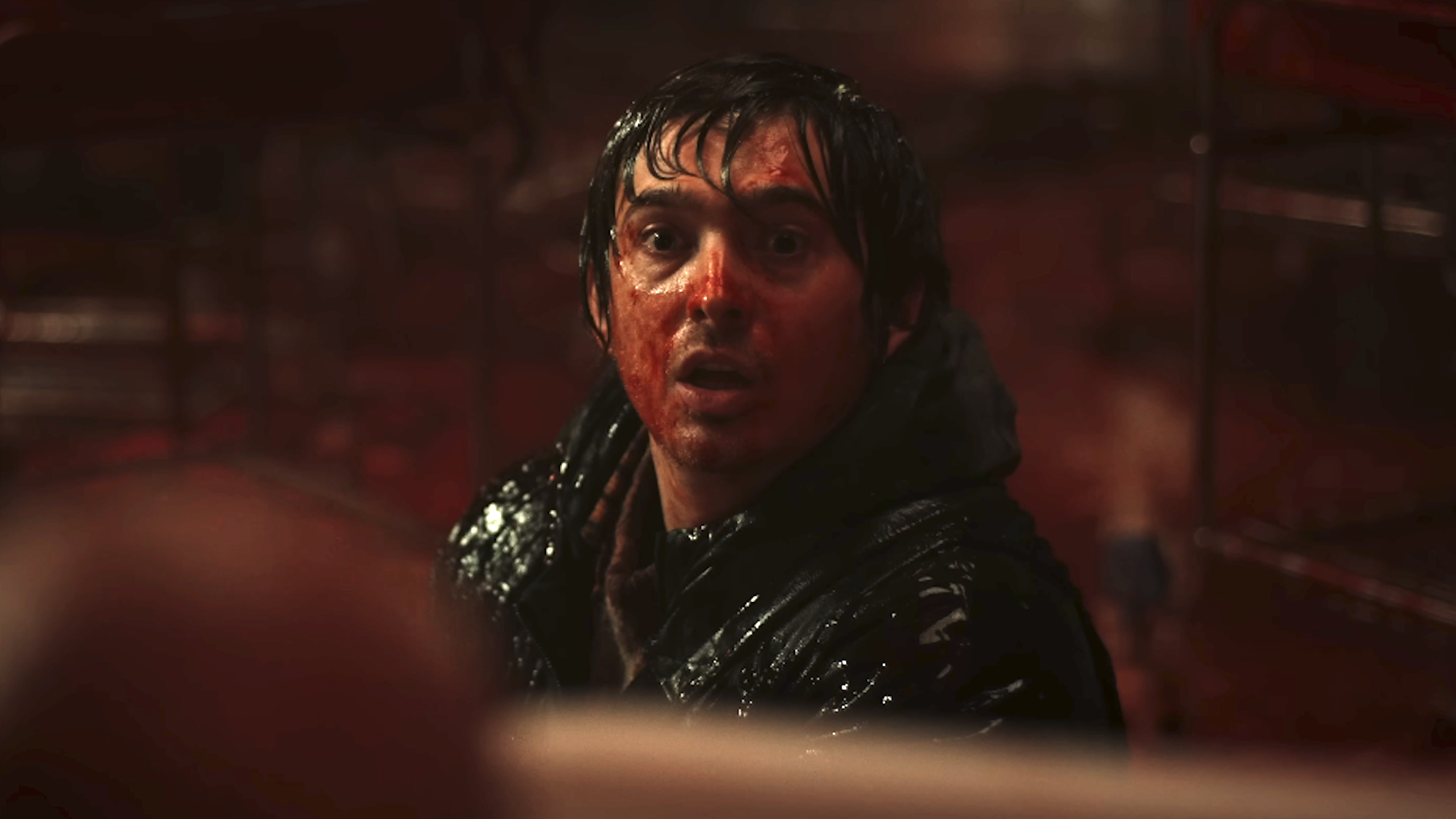 a blood drenched Austin Abrams in Resident Evil