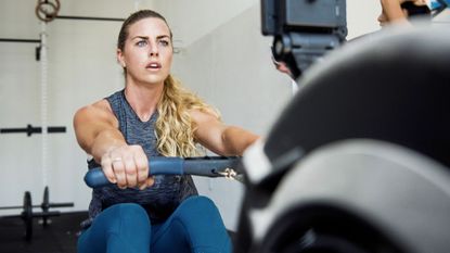 Woman doing a rowing for weight loss session